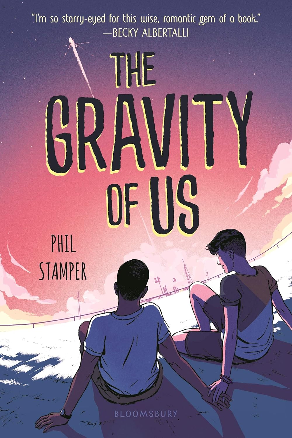 Cover of The Gravity of Us: two boys sit close together under a pink sunset sky as a rocket launches in the distance